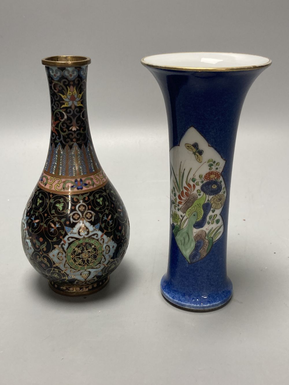 A Chinese powder blue ground vase and a similar cloisonne bottle vase, height 15cm